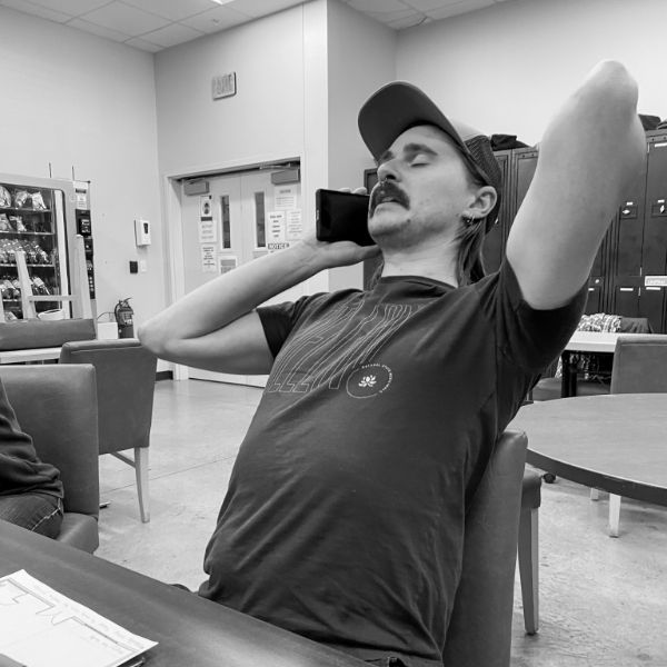 A worker taking a break in the break room