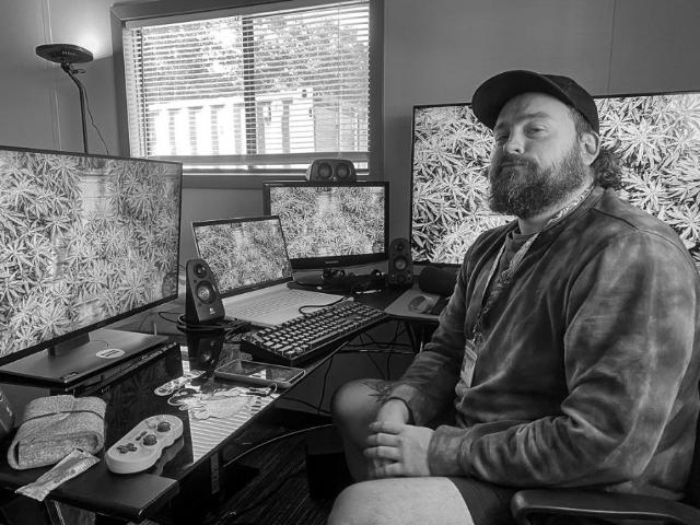 A member of the office crew at his desk