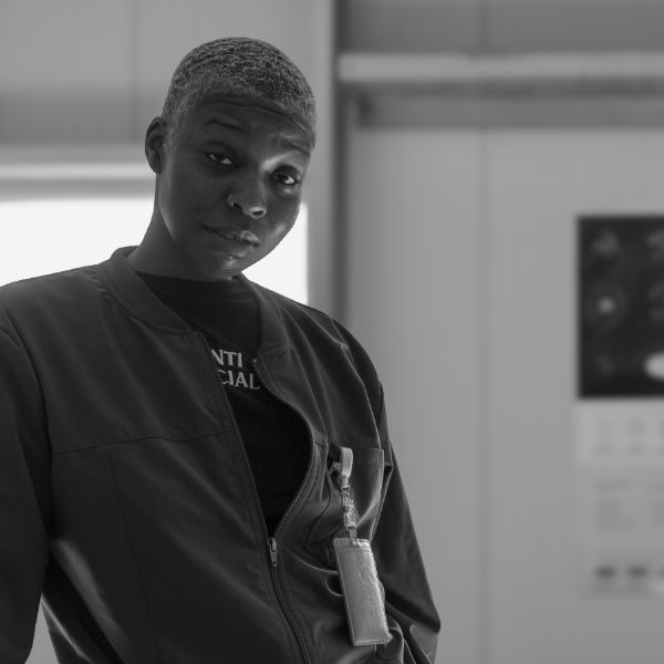 A member of the crew by the packaging room door